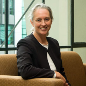 Headshot of Dr. Heather Douglas, smiling, in a black jacket and white top